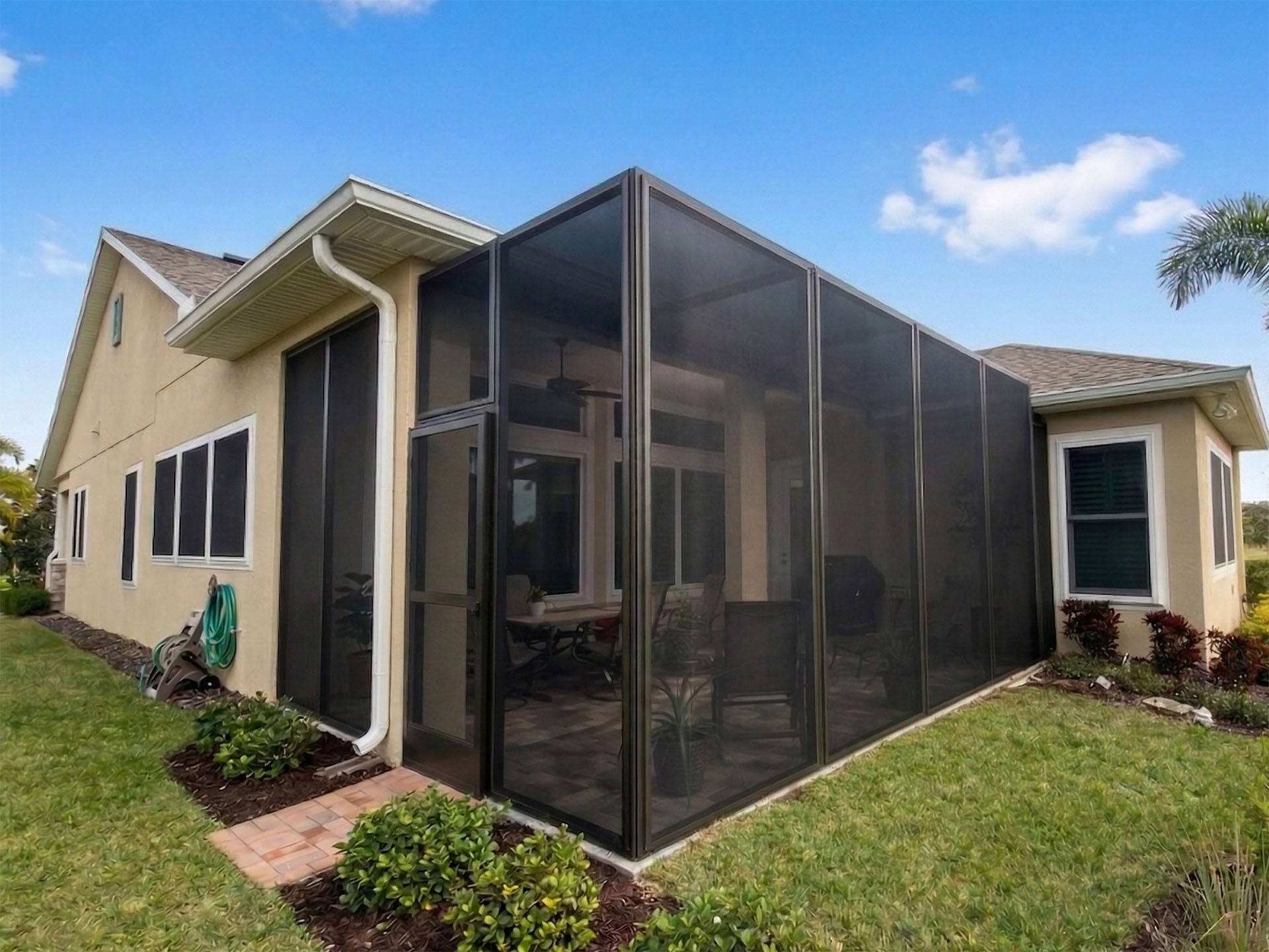 Fortress Screens lanai and window protection installed on a Florida home