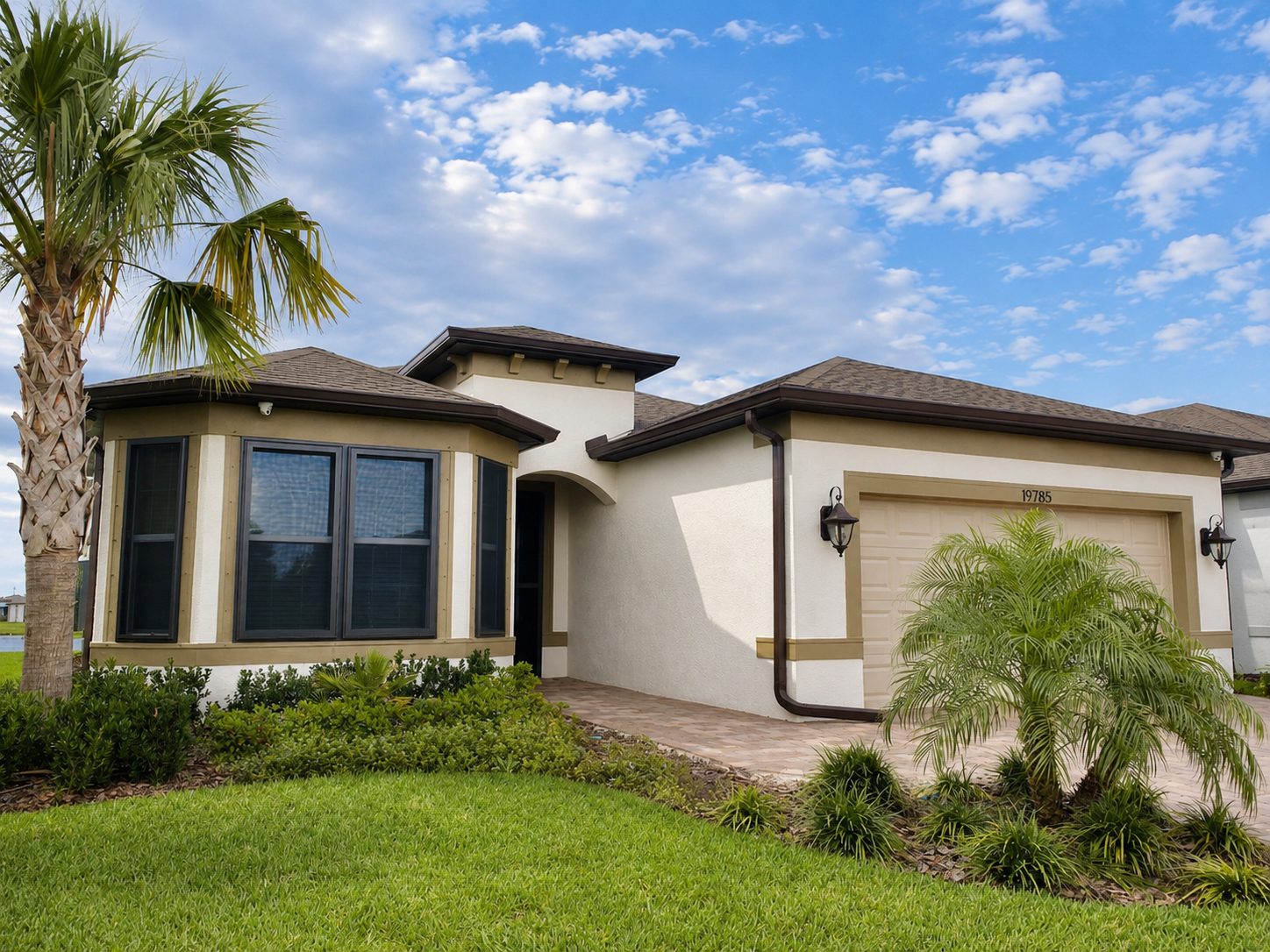 Bay window on a stucco Florida home fitted with custom Fortress screens