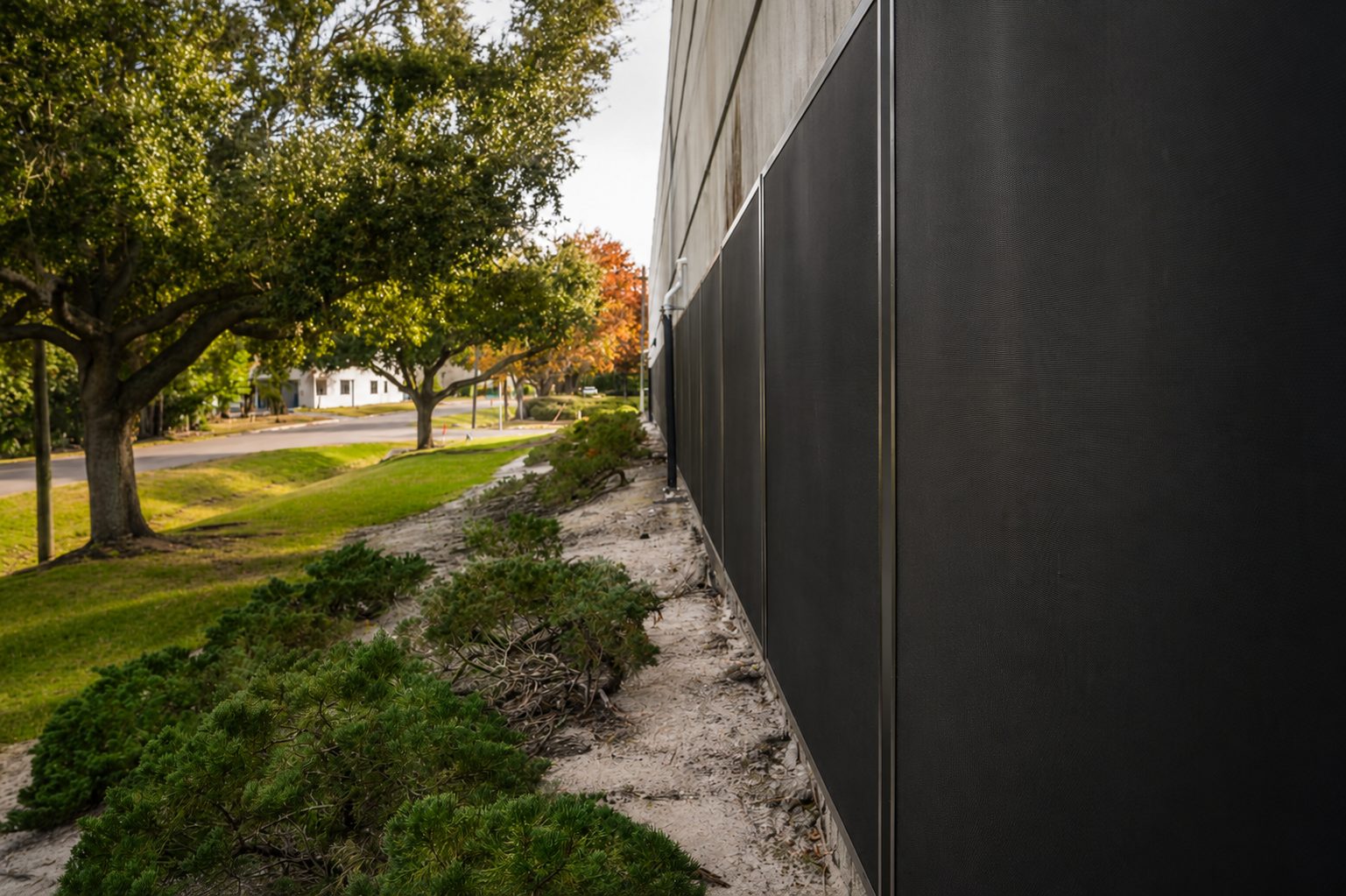 Row of windows on a medical laboratory building protected by stainless steel security screens