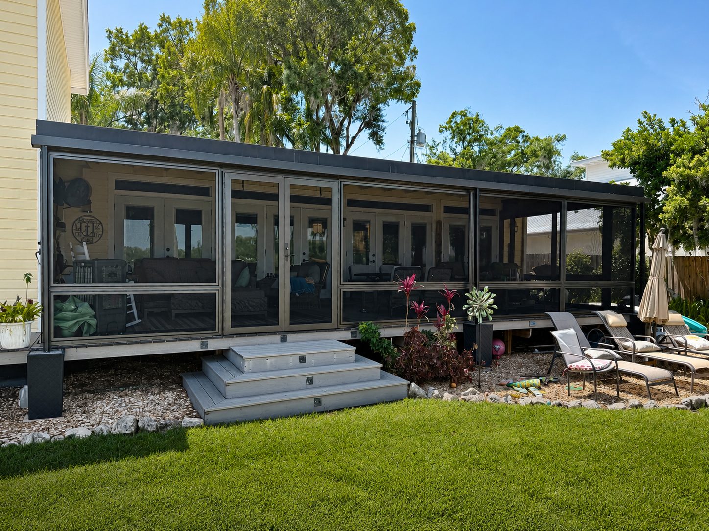 Covered patio on a Florida home enclosed with Fortress protective screens
